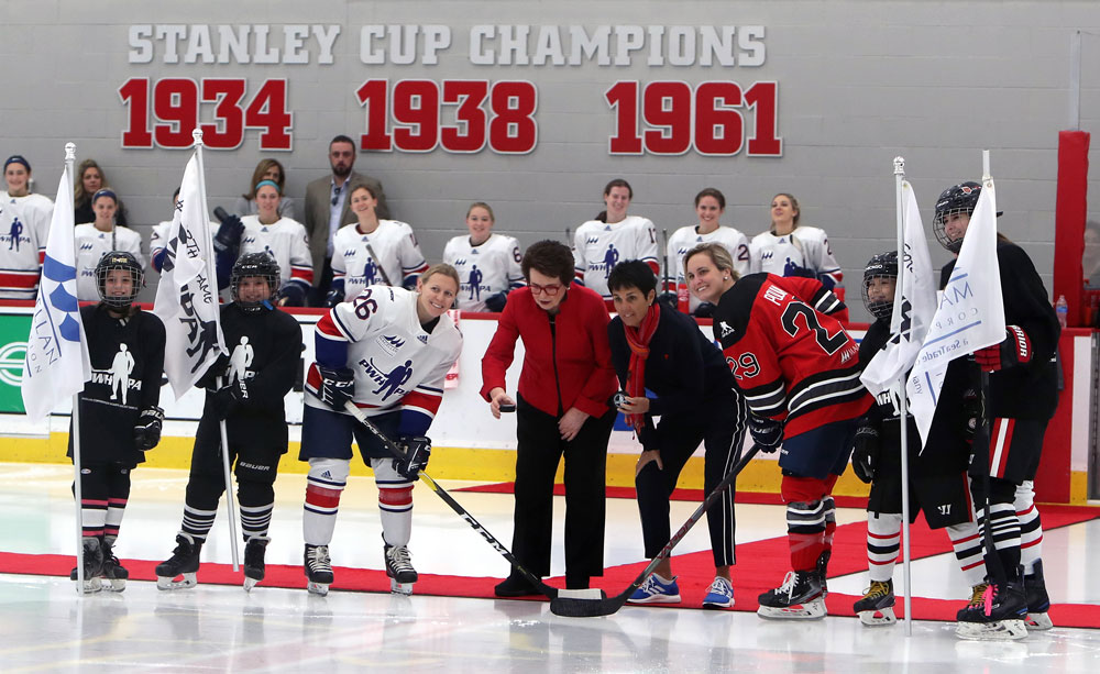 Billie Jean King and Illona Kloss drop the puck at the PWHPA’s Dream Gap Tour Megellan Showcase in Chicago, Il, with Kendall Coyne Schofield of Team Granato and Marie-Philip Poulin of Team Hefford. (Photo by Paul Stinsa/Hockey Hall of Fame).