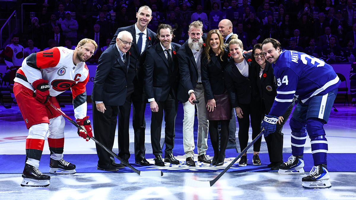 The Class of 2025 takes part in the ceremonial puck drop at the 2025 Hockey Hall of Fame Game.